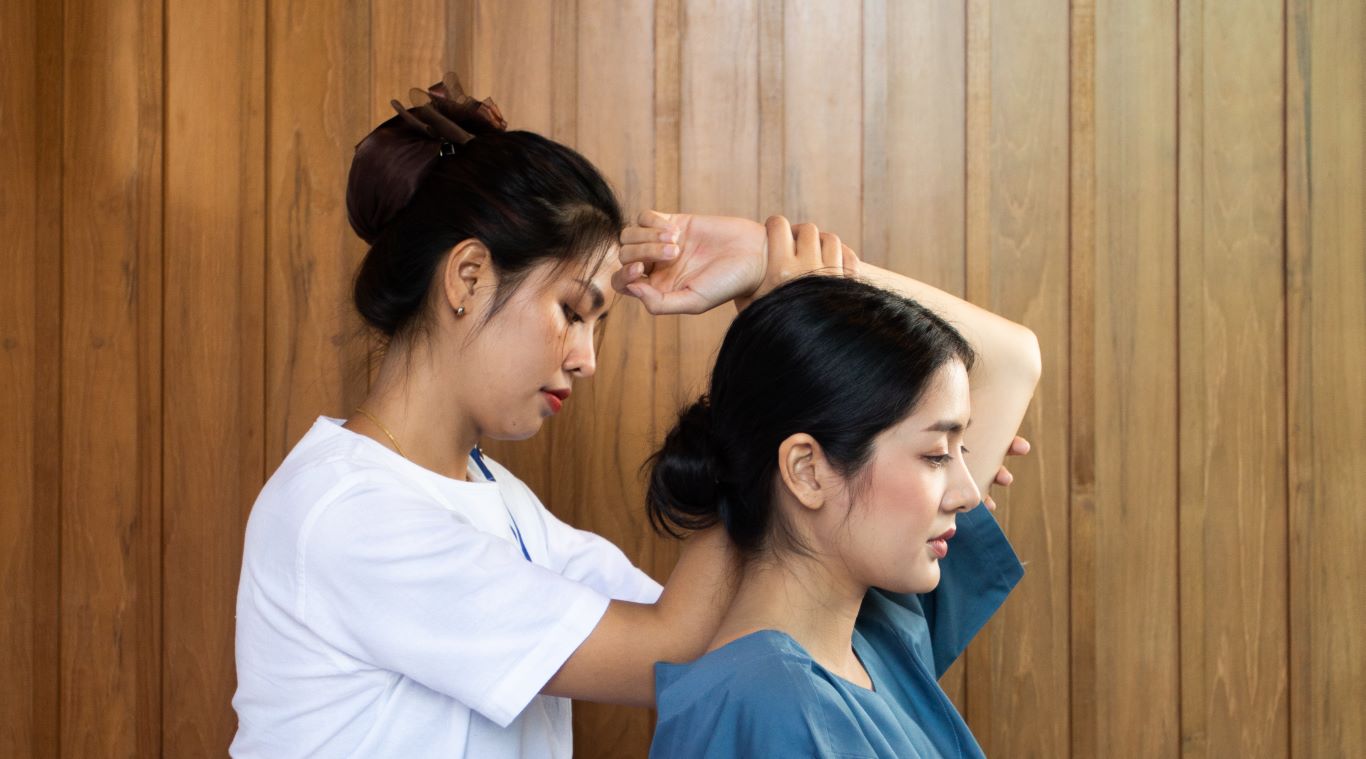 A customer receiving a Thai massage at Makkha Health & Spa