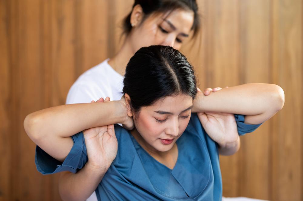 A woman having a traditional Thai massage.