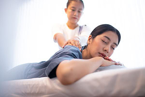 Asian woman having a Thai massage