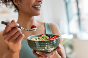 A woman eating healthy food before a massage