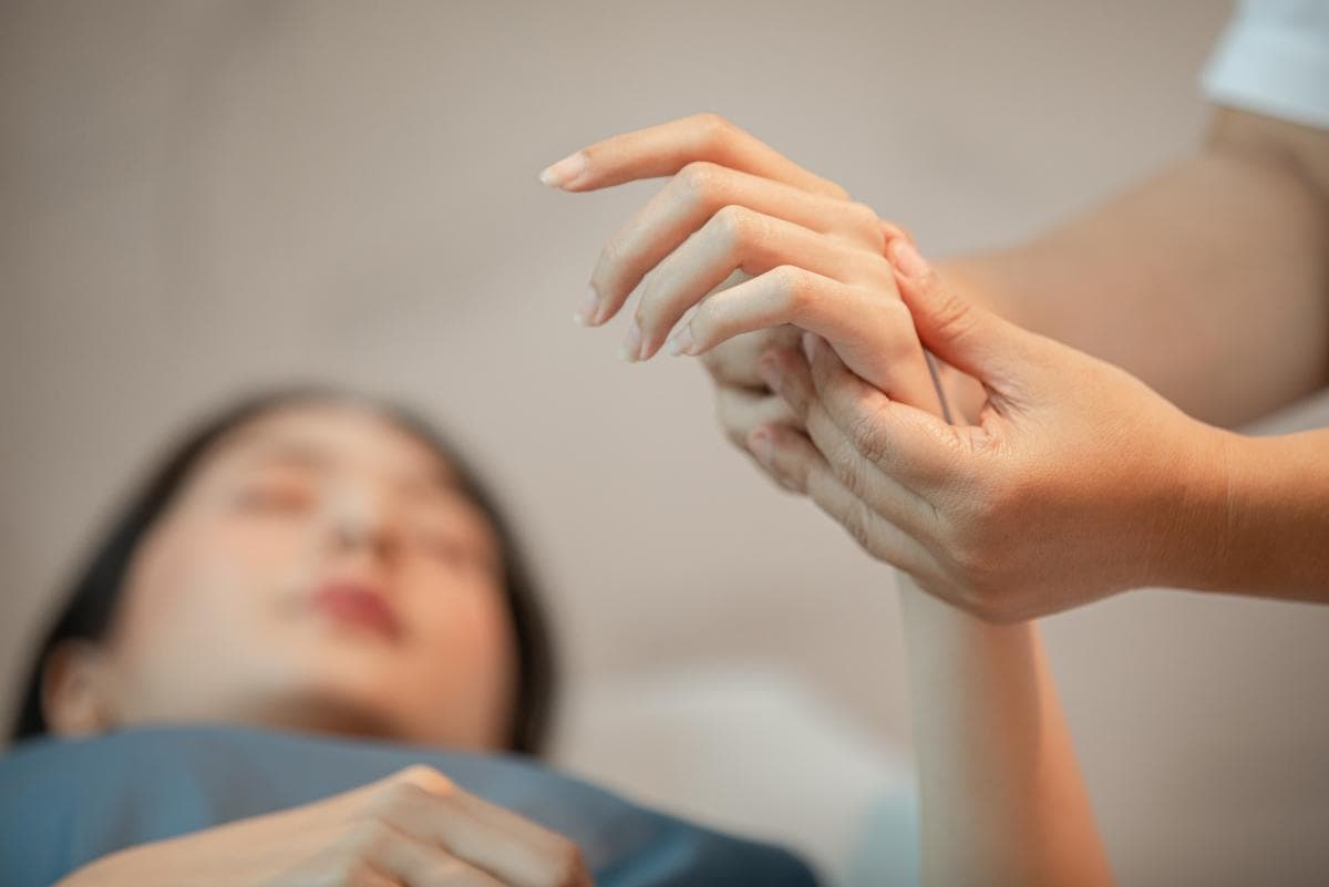 A guest receiving a Thai balm massage at Makkha Health & Spa