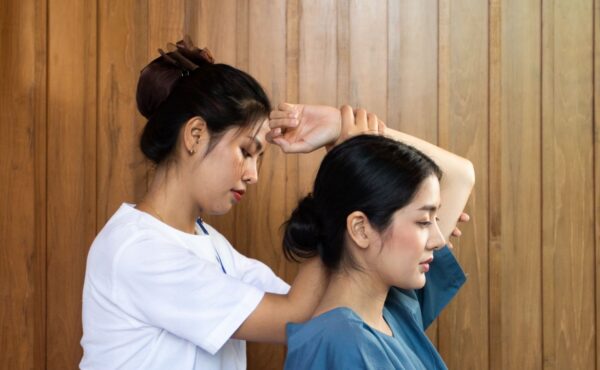 A customer receiving a Thai massage at Makkha Health & Spa